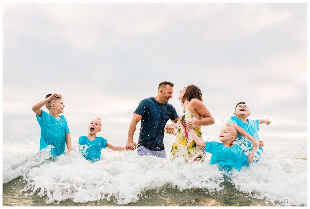 Family playing in the ocean in Coronado, California