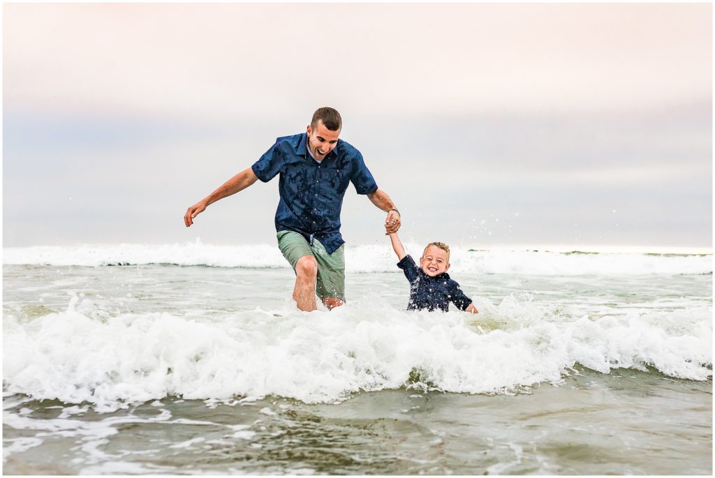 Portrait of father and son playing in the Ocean in San Diego, California