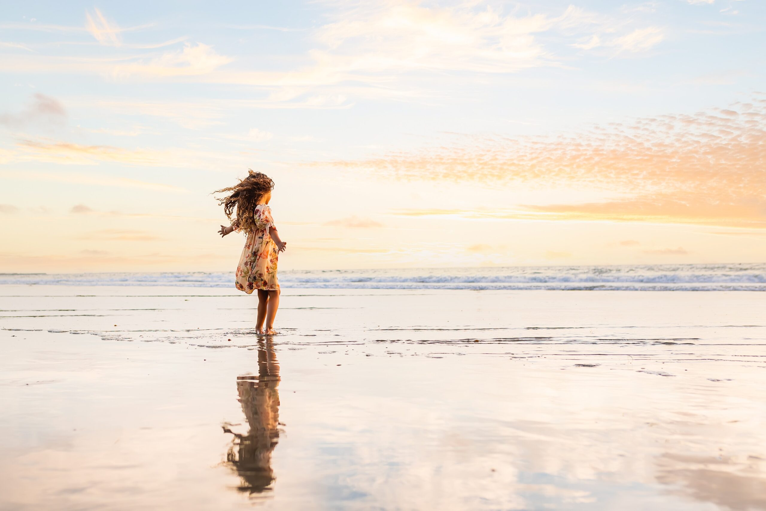 Girl on San Diego beach with reflection taken by Loni Brooke Photography
