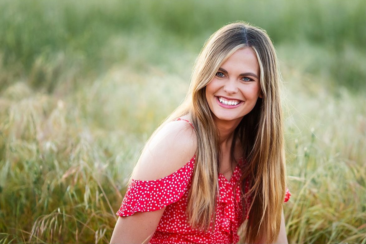 Woman smiling in a field in San Diego